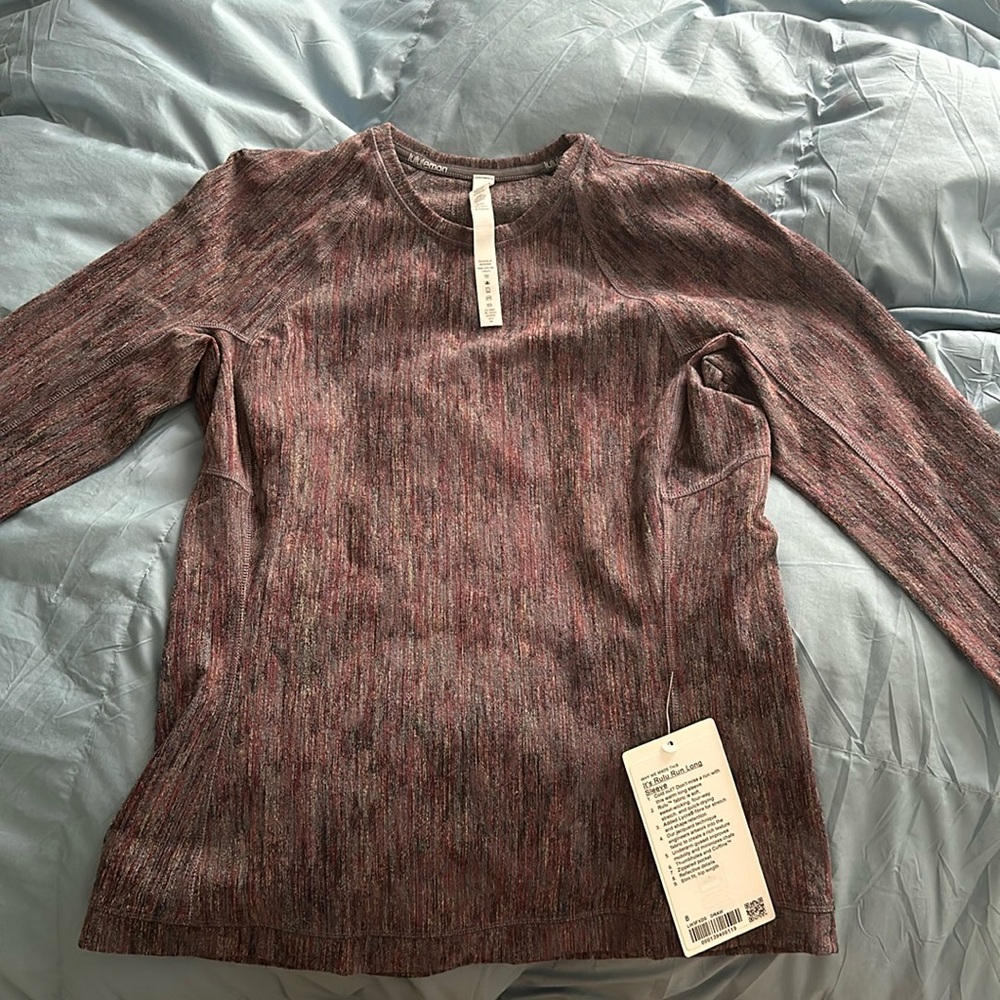 Its rulu run long sleeve lululemon shirt. Never been worn! Tags still on! Size 8
